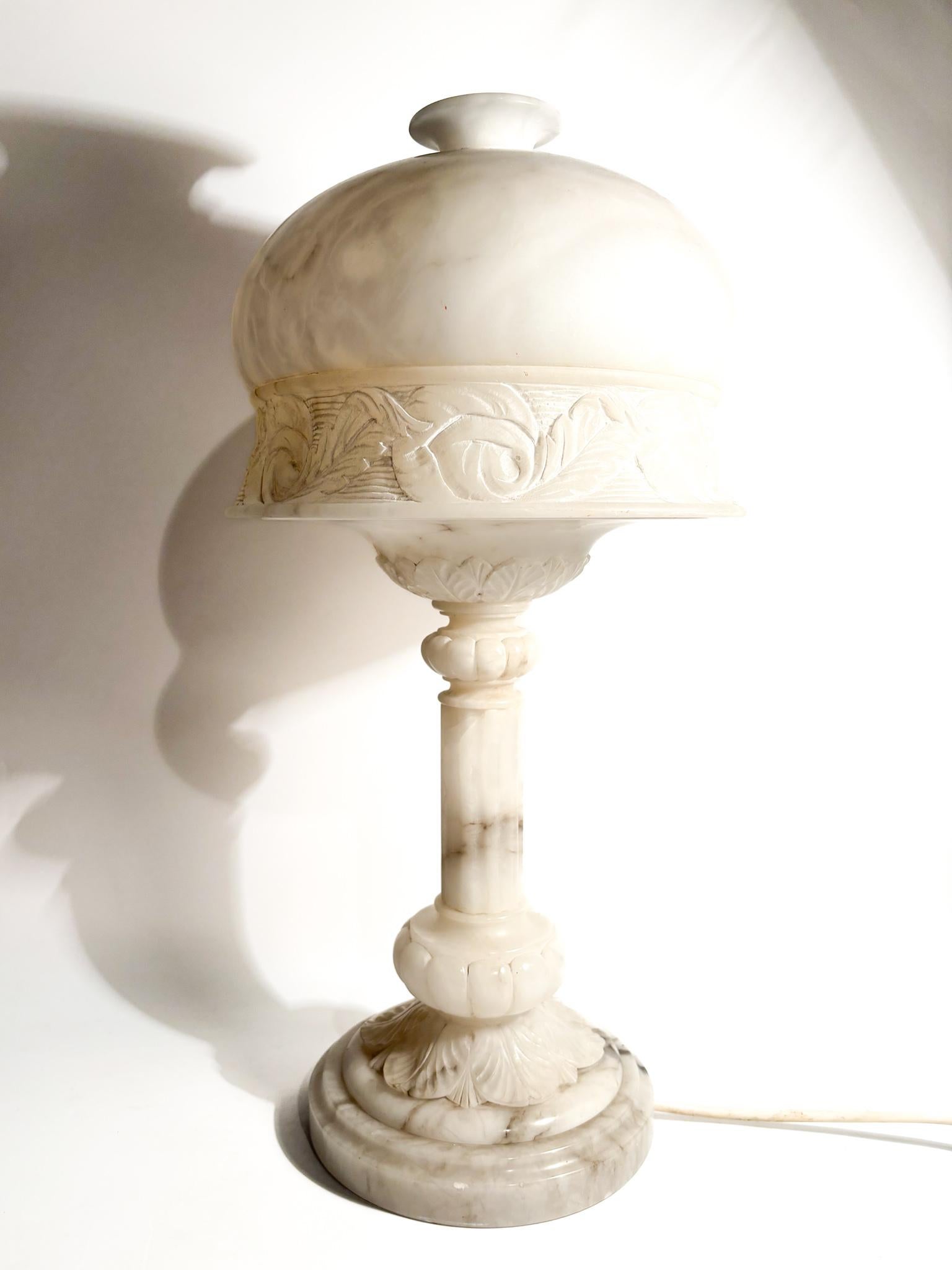 Single-light table lamp in alabaster, decorated in relief, made in the 1950s

Ø 48 cm h 24 cm

Alabaster is a mineral or rock commonly used to carve decorative objects and sculptures. It is a soft and easily workable stone, typically white or light