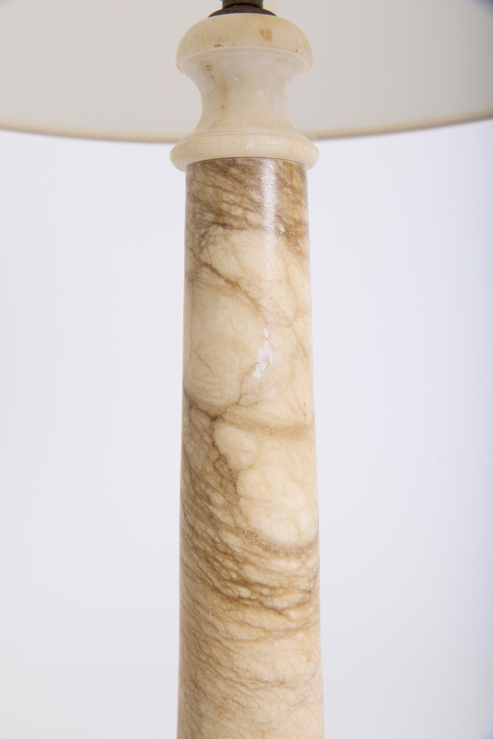 A Neoclassical alabaster table lamp
France, Circa 1920
With the shade: 75 cm high by 46 cm diameter
Lamp base only: 51 cm high by 13 cm diameter