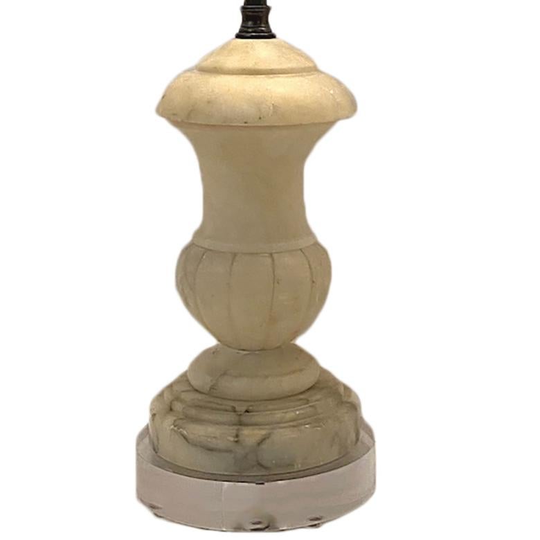 A circa 1950's Italian alabaster table lamp with lucite base.

Measurements:
Height of body: 9.75
