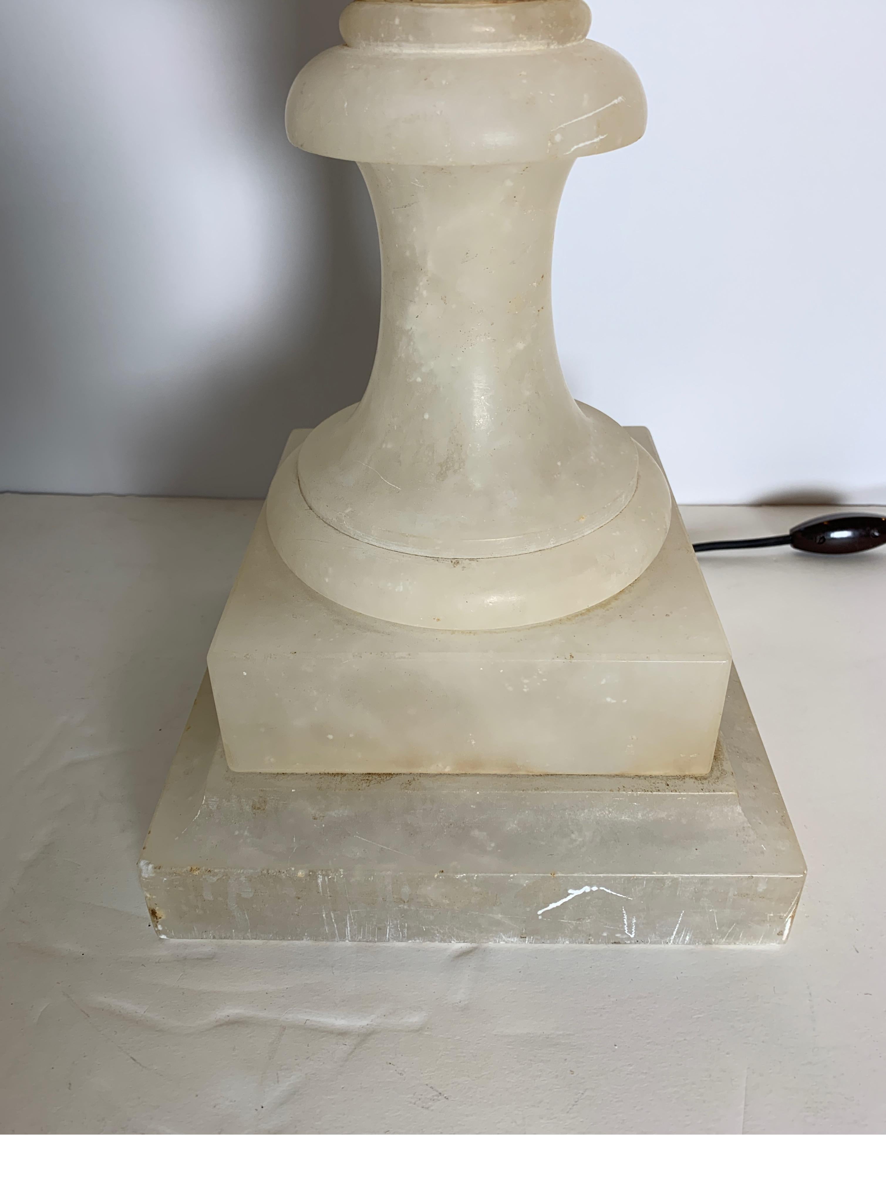 Elegant neoclassical Italian alabaster urn form lamp in two parts. The urn form with Grecian styled handles that open near the center for changing the light bulb.