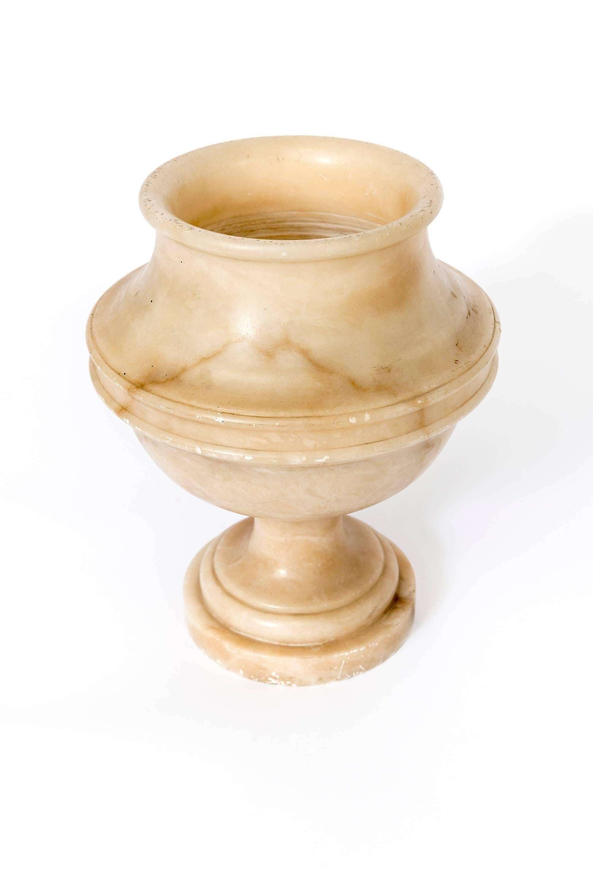 A French Alabaster vase or urn from the 19th Century.
Centre dimension 12 inch diameter
Base dimension 7 inch diameter.