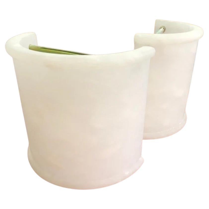 Pair of Alabaster wall sconces, white with half cylinder shape.
 Minimalist , Art Deco

Natural alabaster sconces or wall lamps in the shape of a half cylinder in white with the typical gray vein of white Mediterranean alabaster
 It has a hanging