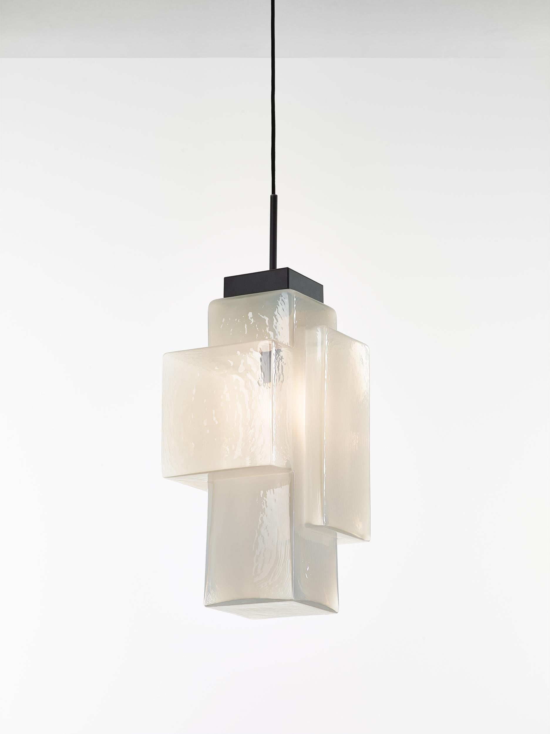 Alabaster white tetris pendant light by Dechem Studio
Dimensions: W 30 x D 23 x H 200 cm
Materials: metal, glass.
Also available: different colors available.
In this complex lighting fixture, strict geometric and architectural lines contrast with