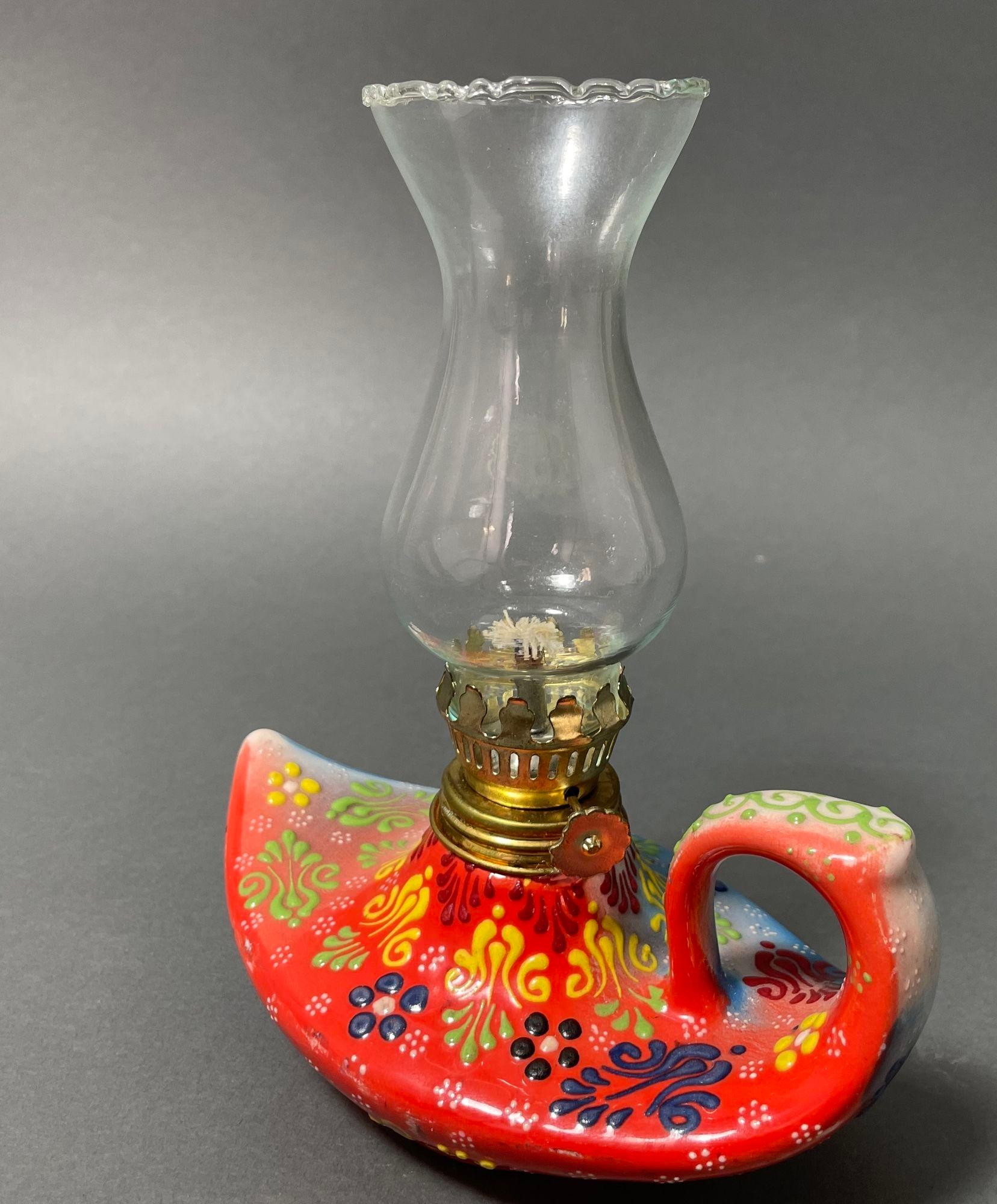 Vintage Aladdin style handmade red ceramic Turkish oil lamp, hurricane oil lamp lantern.
This oil lamp has a pottery base that evokes an Aladdin's Lamp out of the Arabian Nights.
Textured hand-painted ceramic with traditional Turkish floral