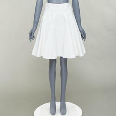 ALAIA 10 CORSO COMO elfenbeinfarbener, gestufter Baumwoll-Knierock mit Schlagleiste FR38 M