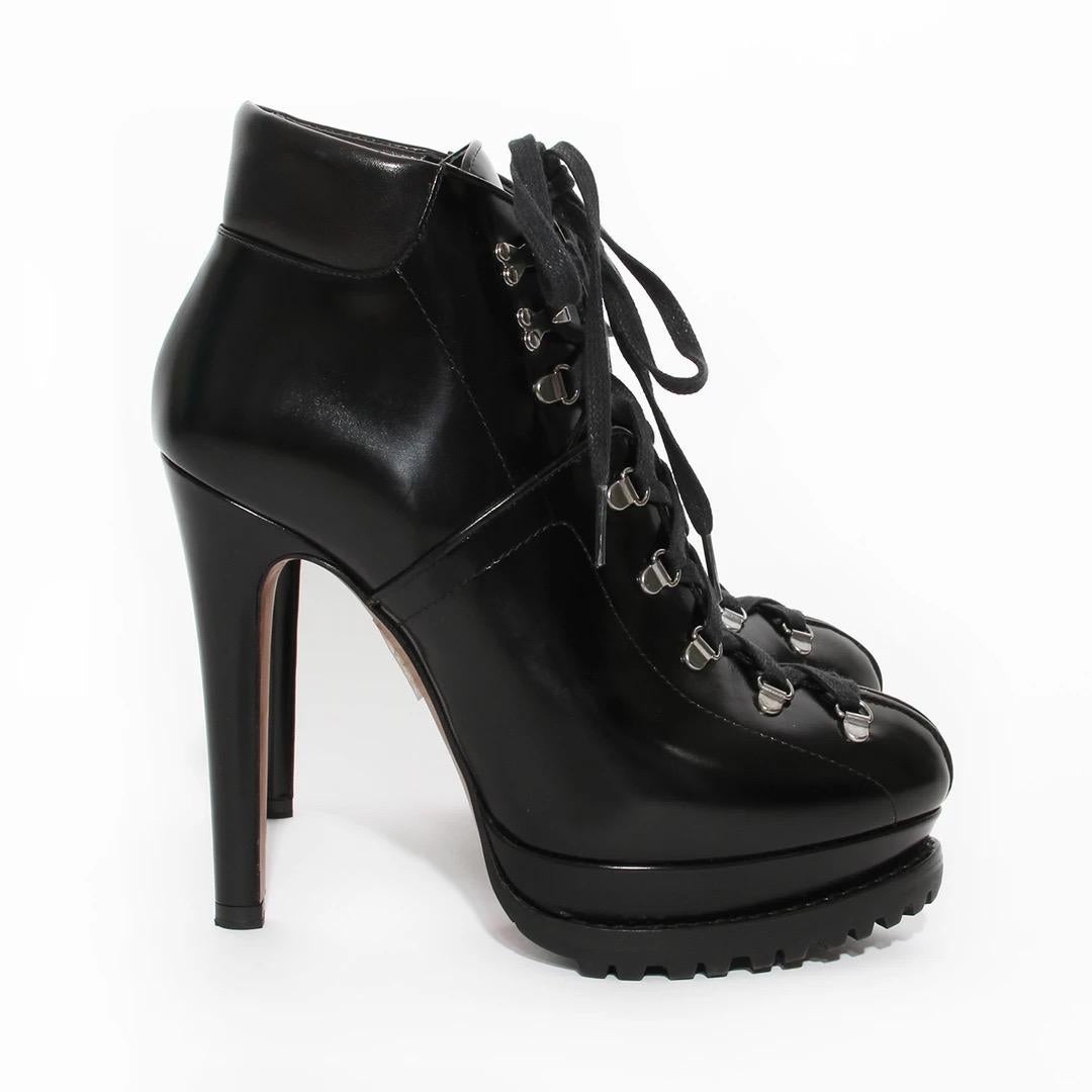 Alaïa 130 Leather Ankle Boot 
Made in Italy 
Hiking style look
Black smooth leather 
Padded heel collar 
Lug sole 
Gunmetal lace eyelets up front of boot
Like new condition; Unworn like new boots comes with box and dust bags. 
 Size/Measurements: