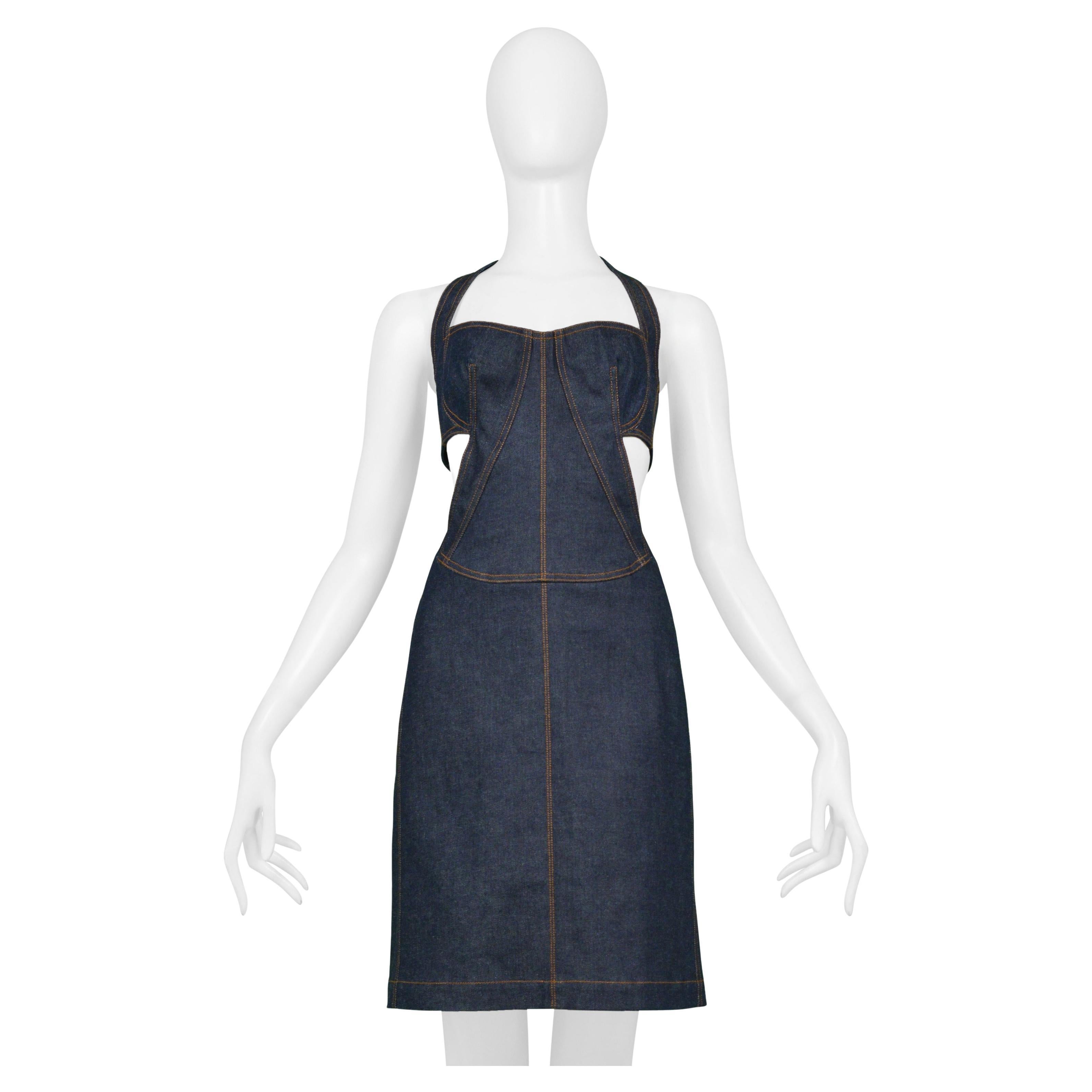 Resurrection Vintage is excited to offer a vintage Azzedine Alaia blue denim dress featuring a 1986 reissued design, cutout back, halter style neck, brown top stitching, and mini dress length. 

Azzedine Alaia Paris
Size 40
98% Cotton, 2%