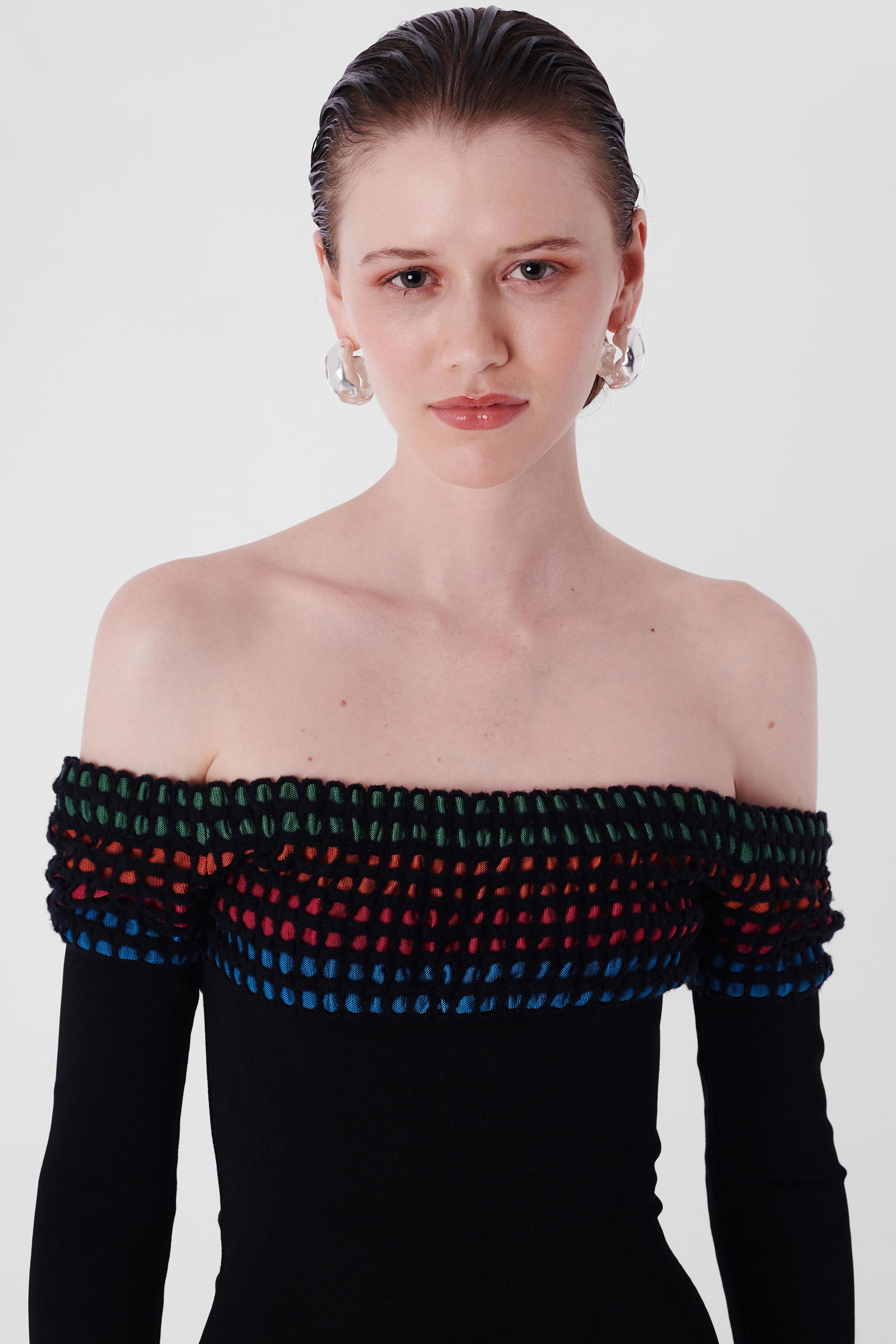 Alaia 1990's Black Contour Bodycon Dress. Features off shoulder neckline, long sleeves, rainbow crochet neckline and hem, concealed back zipper and mini length. In excellent vintage condition.

Label size: N/A
Modern size: UK: 8 to 10, US: 2 to 6,
