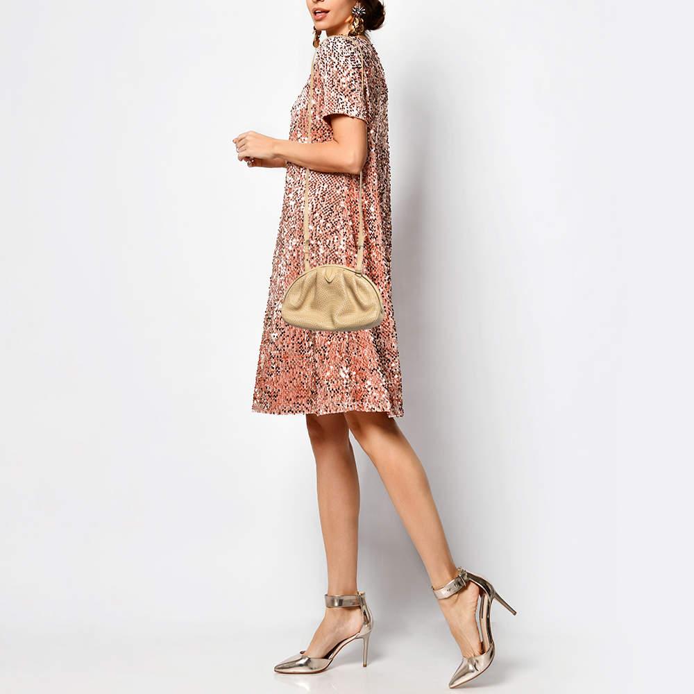 This Alaia bag beautifully shows quality craftsmanship. The interior of this gorgeous bag is lined with suede and fitted with a shoulder strap that allows for crossbody wear.