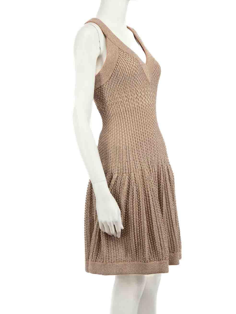 CONDITION is Very good. Hardly any visible wear to dress is evident on this used Alaïa designer resale item.
 
 
 
 Details
 
 
 Beige metallic
 
 Viscose
 
 Knit dress
 
 Sleeveless
 
 V-neck
 
 Dotted textured knit detail
 
 Mini
 
 Stretchy
 
