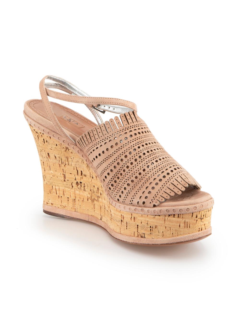 CONDITION is Never worn. No visible wear to wedges is evident on this new Alaïa designer resale item. Comes in original box with dust bag.
 
 Details
 Beige
 Suede
 Sandals
 Perforated accent
 Open toe
 Cork high wedge heel
 Ankle buckled strap