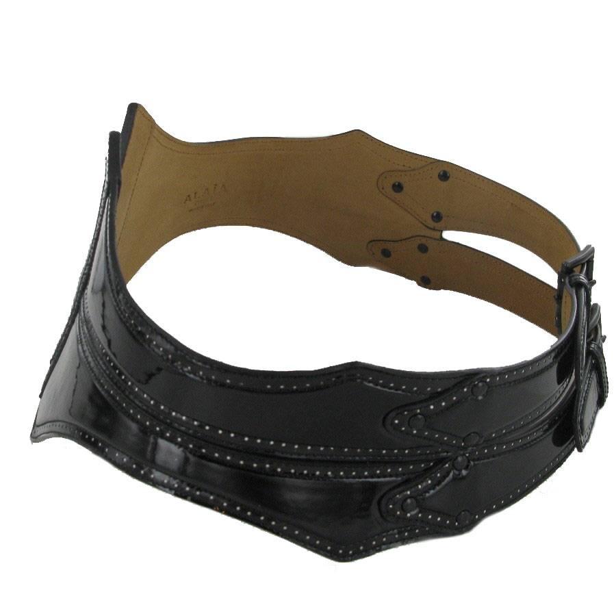 Beautiful ALAIA black patent leather belt. Ultra trendy collector's item. It is Perforated black patent leather. 2 buckles in gunmetal color.

2 water stains on the inside of the belt. Size 85

Dimensions : Length: 92 cm, Width: 16.5 cm