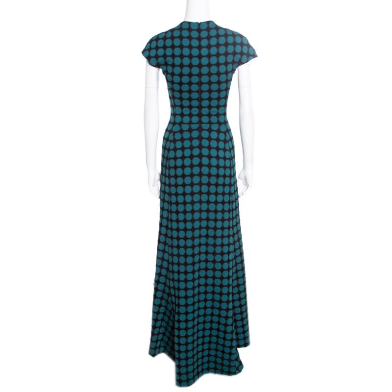 The search for a chic and stylish dress ends with this amazing maxi number from Alaia! The black and green creation is made of a blend of fabrics and features a jacquard knit design. It flaunts a round neckline, cap sleeves and a flattering