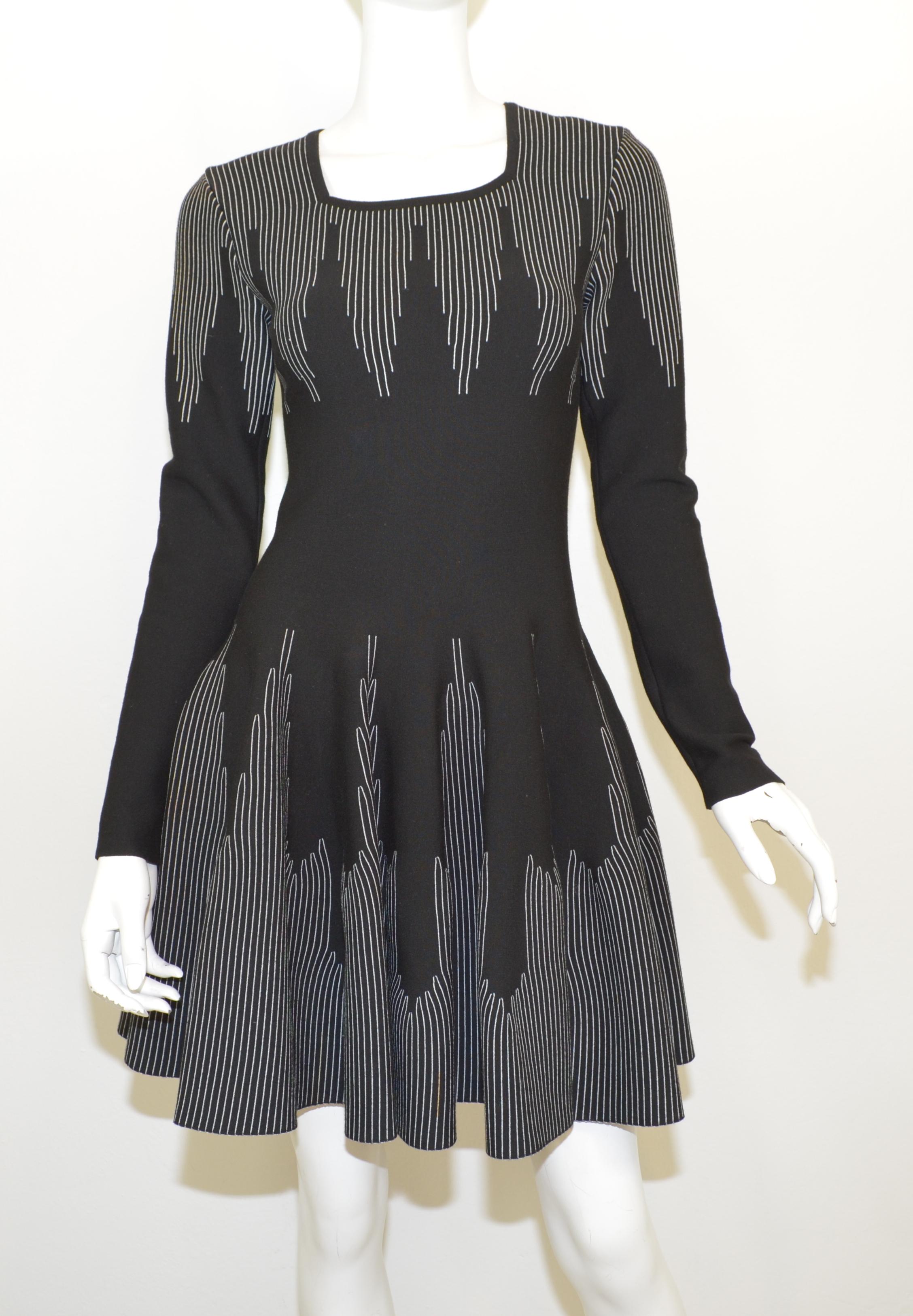Alaia knitted fit and flare knitted dress is featured in black with a white striped/chevron pattern. Dress has a back zipper closure. Made in Italy, size 38. 

Measurements:
Bust 31”
Waist 26”
Hips 38”
Length 34” 
Sleeves 24”