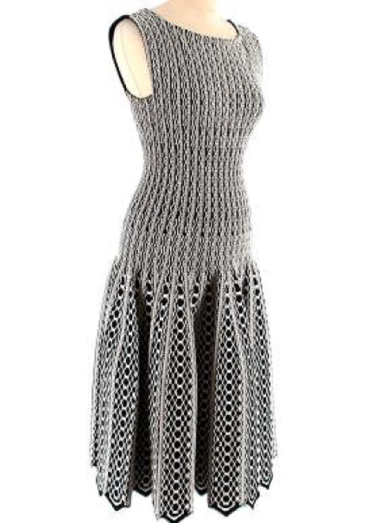 Alaia Black and White patterned skater dress 

-Square neckline 
-Zip fastening along the back 
-Sleeveless 
-Mid-weight with slight stretch 
-Intarsia knit design 
-Pleated from waist 
-Scalloped hem

Material: 

70% Viscose 
20% Polyamide 
6%