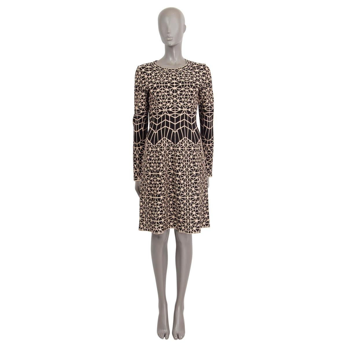 100% authentic Alaia geometric jacquard jersey dress in black and beige viscose (45%), wool (25%), nylon (20%), polyester (6%) and elastane (4%). Features long sleeves and a flared skirt. Opens with a concealed zipper on the back. Unlined. Has been