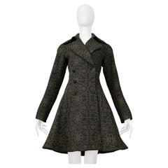 Manteau noir Alaia avec broderie en or métallisé