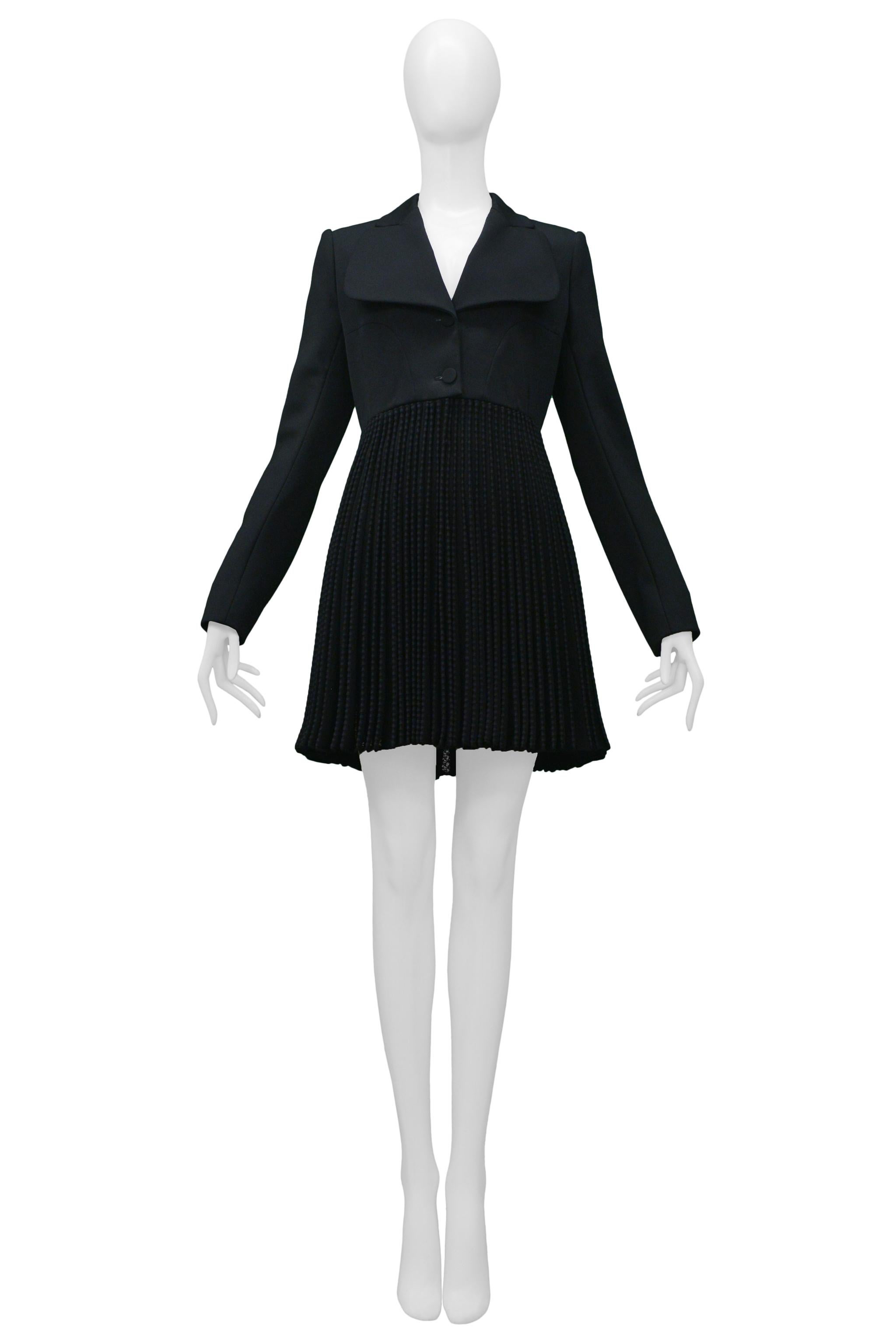 Resurrection Vintage is excited to offer a vintage Azzedine Alaia black coat featuring a pleated skirt with lace, a wide rounded notched collar, and armhole princess seams. 

Alaia Label 
Size: 42
Wool, Polyester, and Cotton
Excellent Vintage