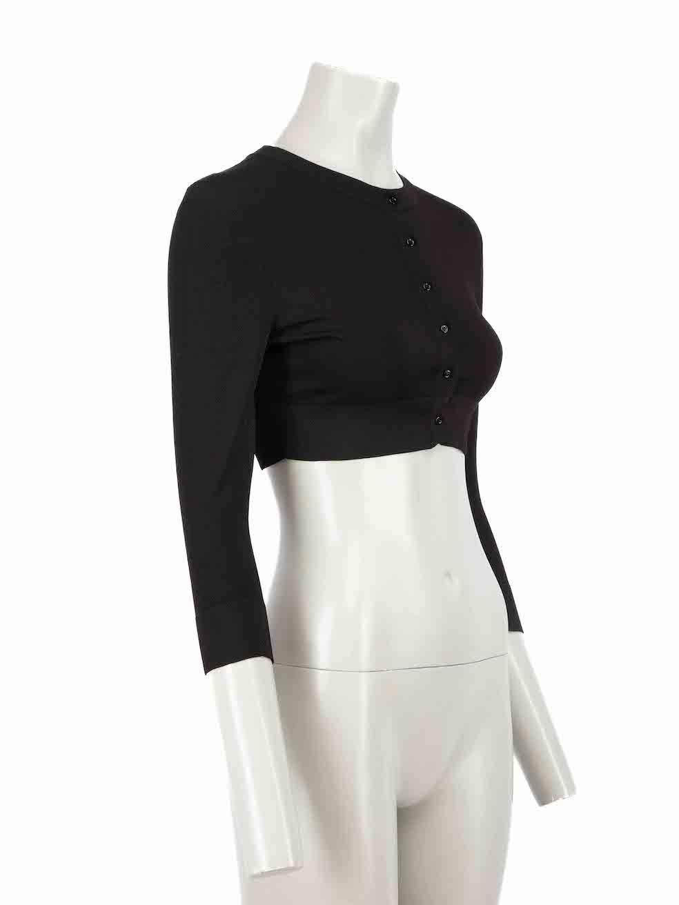 CONDITION is Very good. Hardly any visible wear to knitwear is evident on this used Alaïa designer resale item.

Details
Black
Viscose
Knit cardigan
Cropped fit
Long sleeves
Round neckline
Button fastening

Made in Italy 

Composition
83% Viscose,