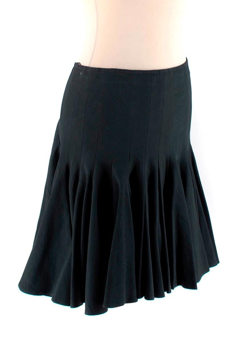 Alaia Black Flared Mini Skirt

-Made of a beautiful textured grosgrain fabric 
-Gorgeous black hue with green undertones 
-Flared effect 
-Round panels to the back 
-Mini length 
-Elegant timeless design 

Materials:
There is no care label but we