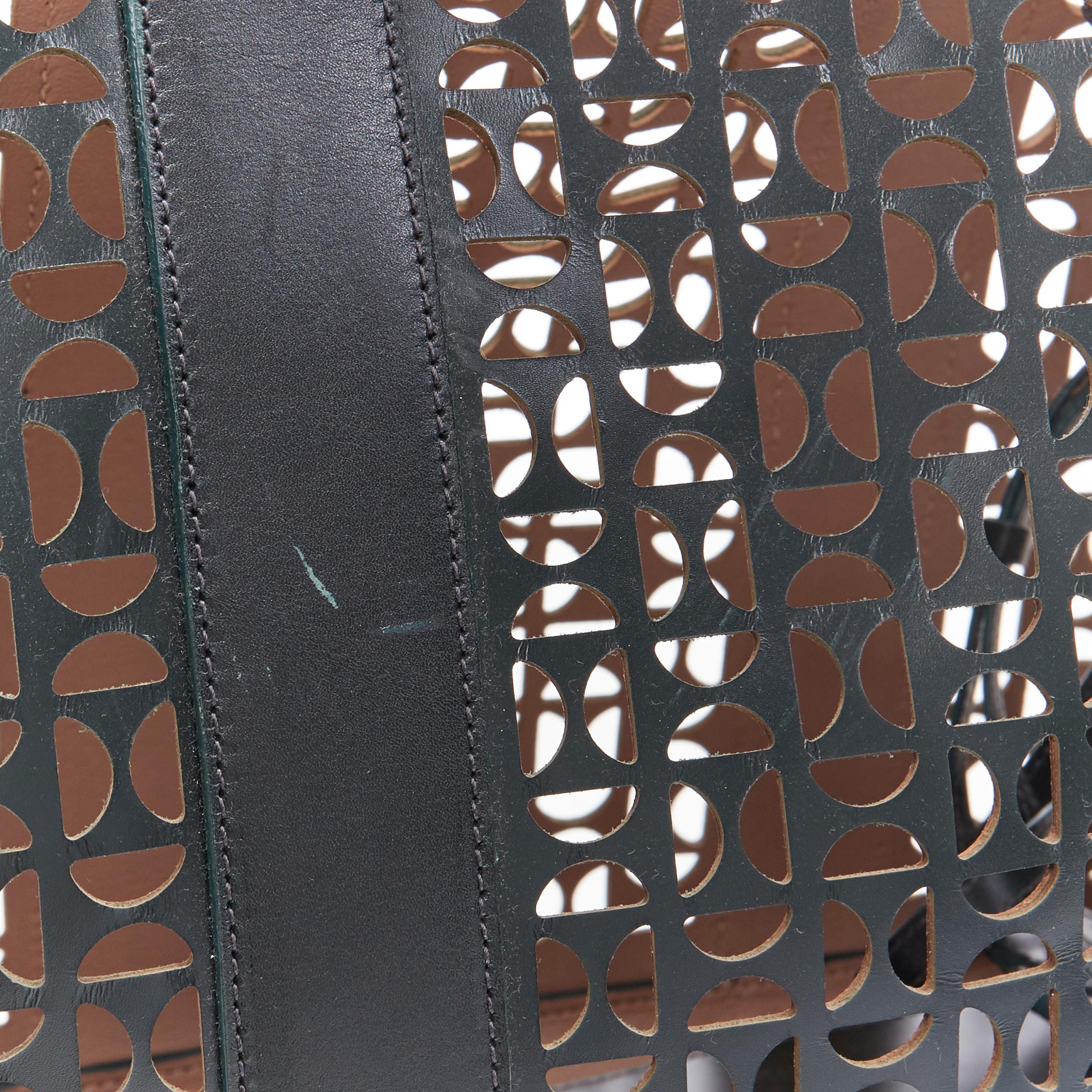 ALAIA black geometric cut out leather expandable sides zip pocket top handle bag 5