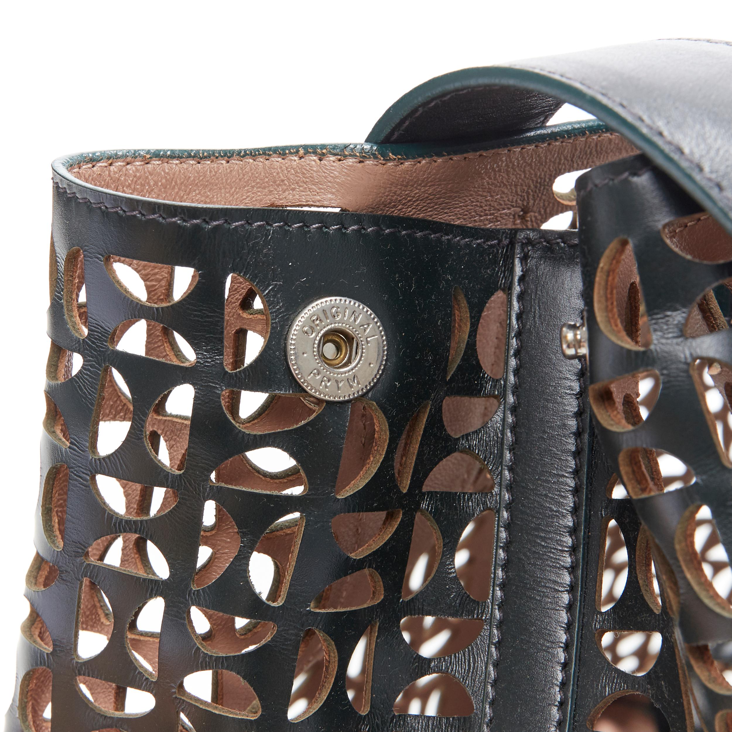 ALAIA black geometric cut out leather expandable sides zip pocket top handle bag 1