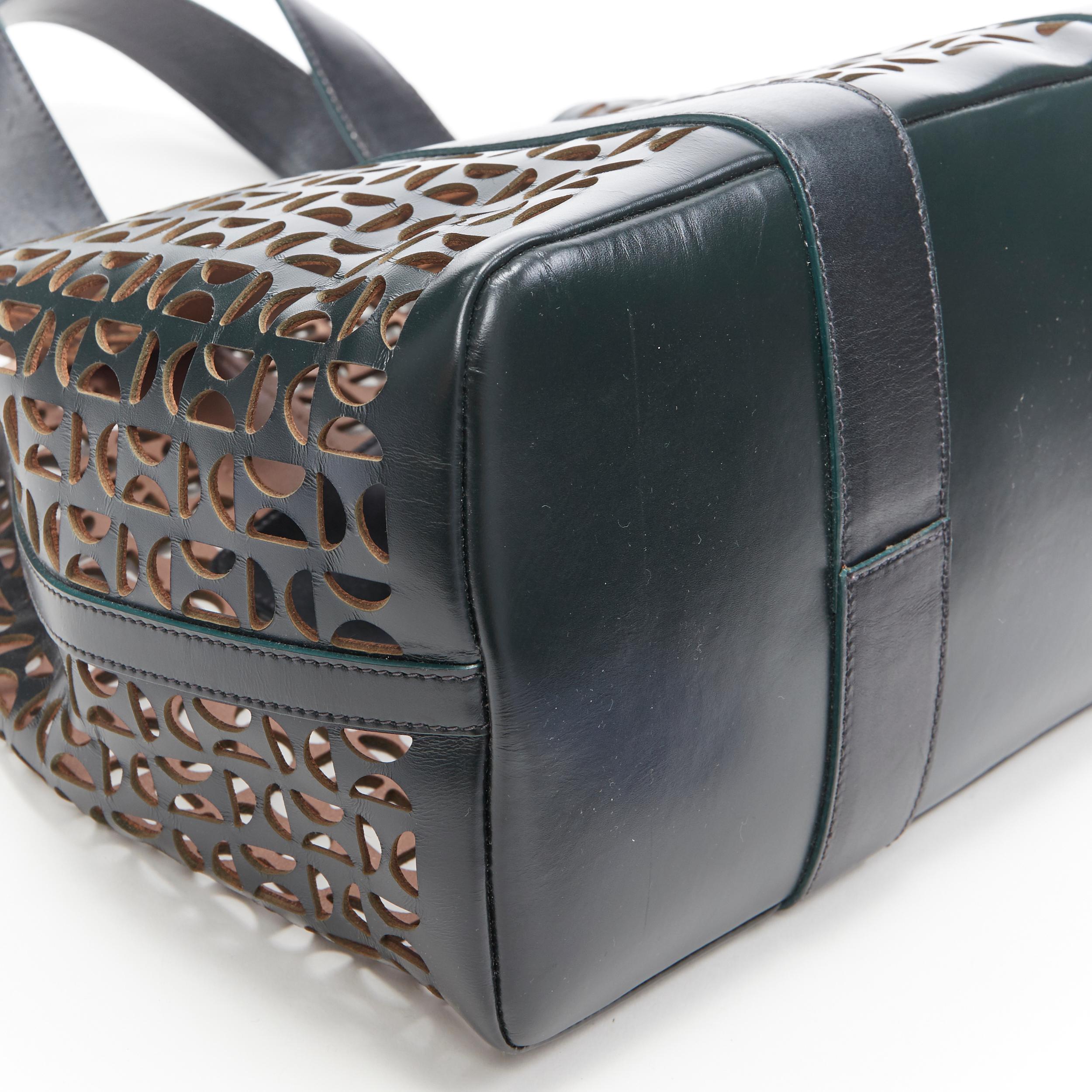 ALAIA black geometric cut out leather expandable sides zip pocket top handle bag 3