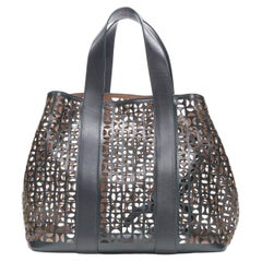 ALAIA black geometric cut out leather expandable sides zip pocket top handle bag