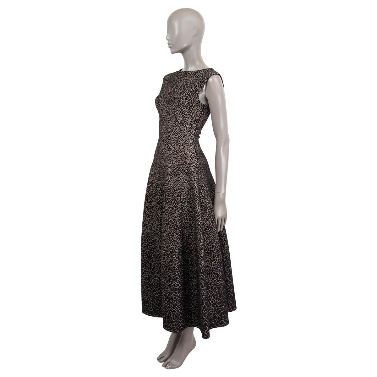 100% authentic Alaia sleeveless lurex maxi dress in black and gold viscose (36%), wool (34%), polyester (13%), metal (9%), nylon (6%) and elastane (2%). Opens with a concealed zipper on the side. Unlined. Has been worn once and is in virtually new