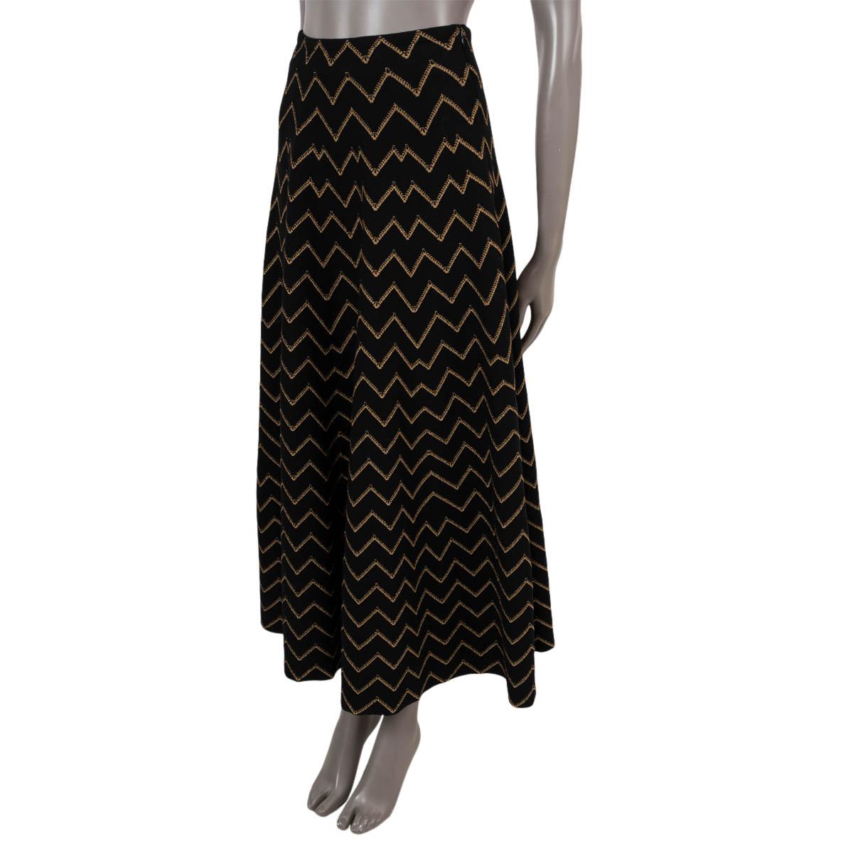 100% authentic Alaia Nazaré chevron draped midi skirt in black and gold wool (46%), viscose (24%), nylon (20%), metal (6%) and elastane (4%). Opens with a concealed zipper and a hook in the back. Has been worn and is in excellent condition.

2019