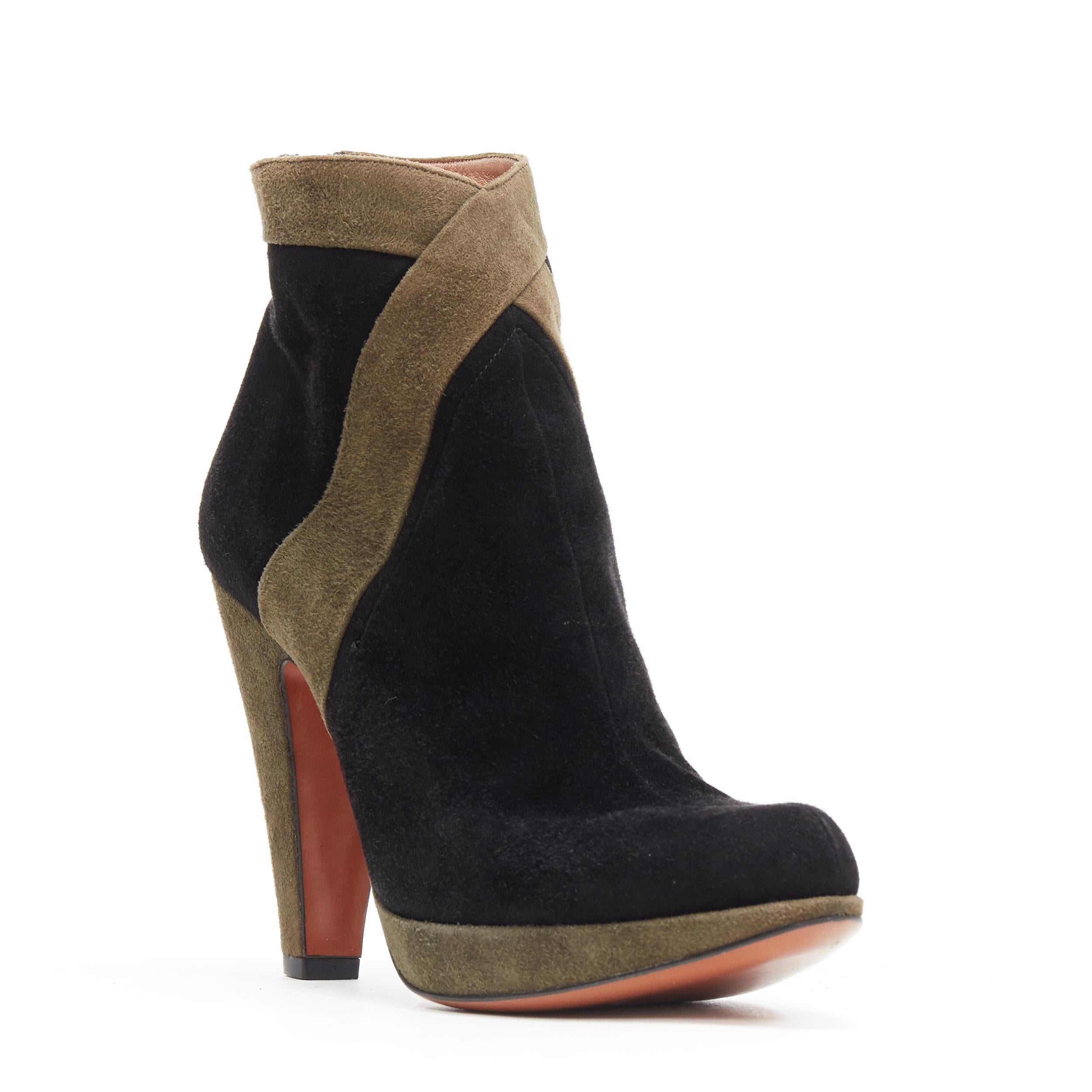 ALAIA black green suede leather cross strap platform high heel ankle bootie EU36
Brand: Alaia
Designer: Azzedine Alaia
Model Name / Style: Ankle bootie
Material: Suede
Color: Black and green
Pattern: Solid
Closure: Zip
Extra Detail: Ultra High (4 in
