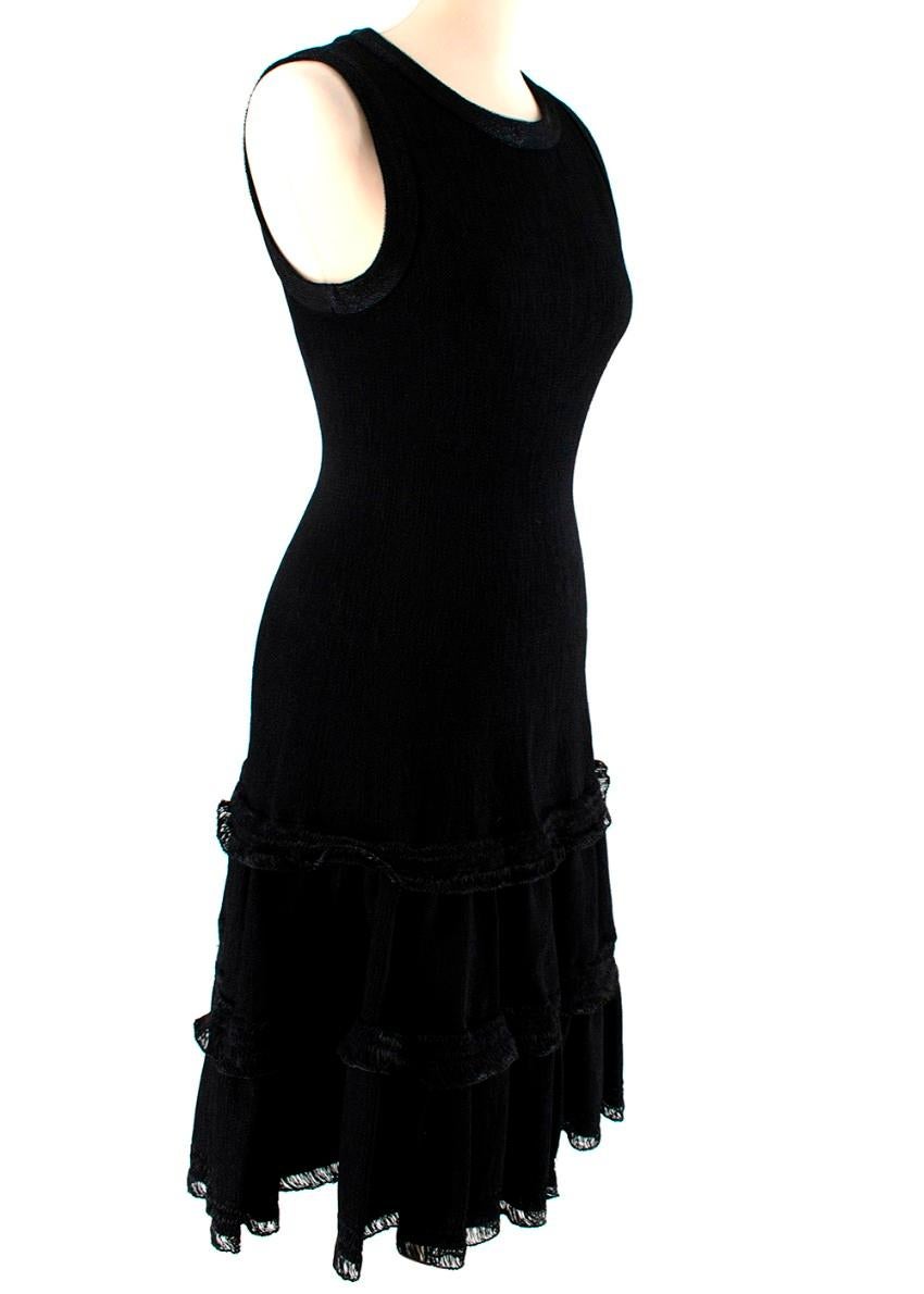 Alaia Black Knitted Sleeveless Dress

-Hidden zipper at the back
-Fit and flare design with knitted detail throughout
-Tiered skirt
-High scoop neckline
-Sleeveless 

Materials:
90% viscose
10% polyester

Made in Italy

Approx. Measurements (Seam to