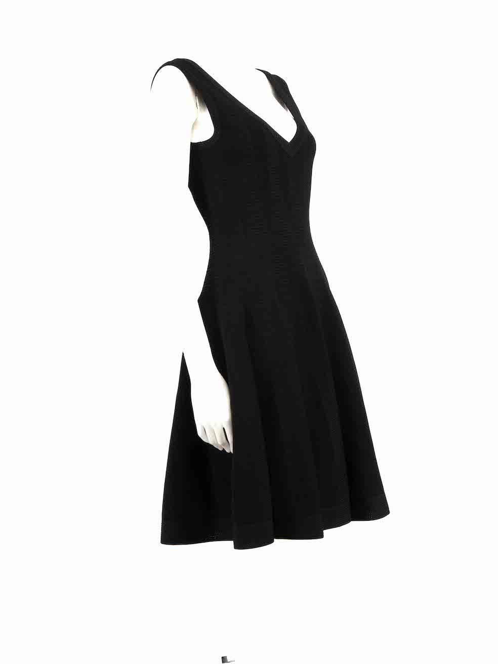 CONDITION is Very good. Hardly any visible wear to dress is evident on this used Alaïa designer resale item.
 
 
 
 Details
 
 
 Black
 
 Viscose
 
 Knee length dress
 
 Knitted and stretchy
 
 V neckline
 
 Textured
 
 Back zip closure
 
 
 
 
 
