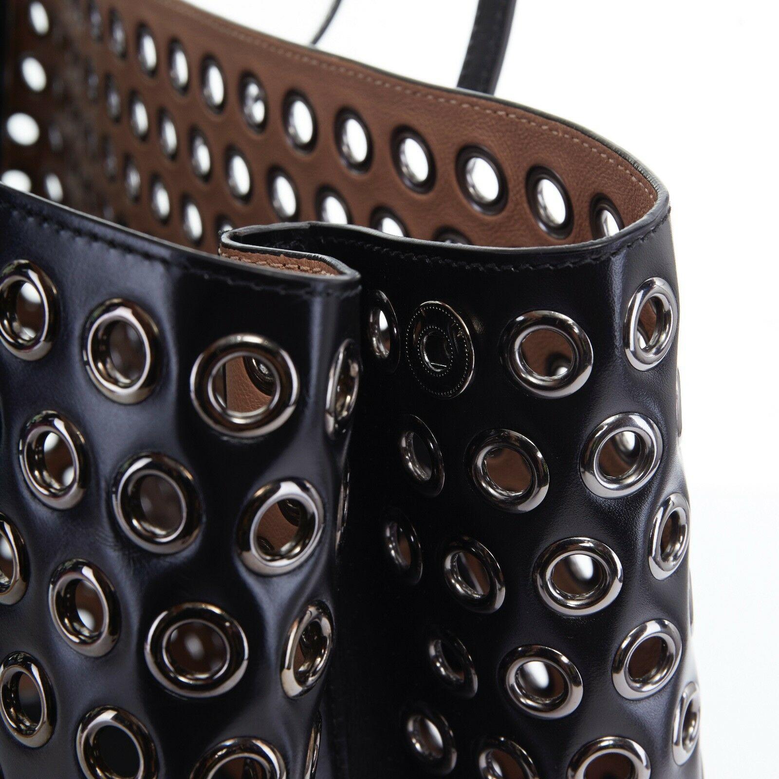 Women's ALAIA black leather gunmetal grommet stud top handle expandable large tote bag