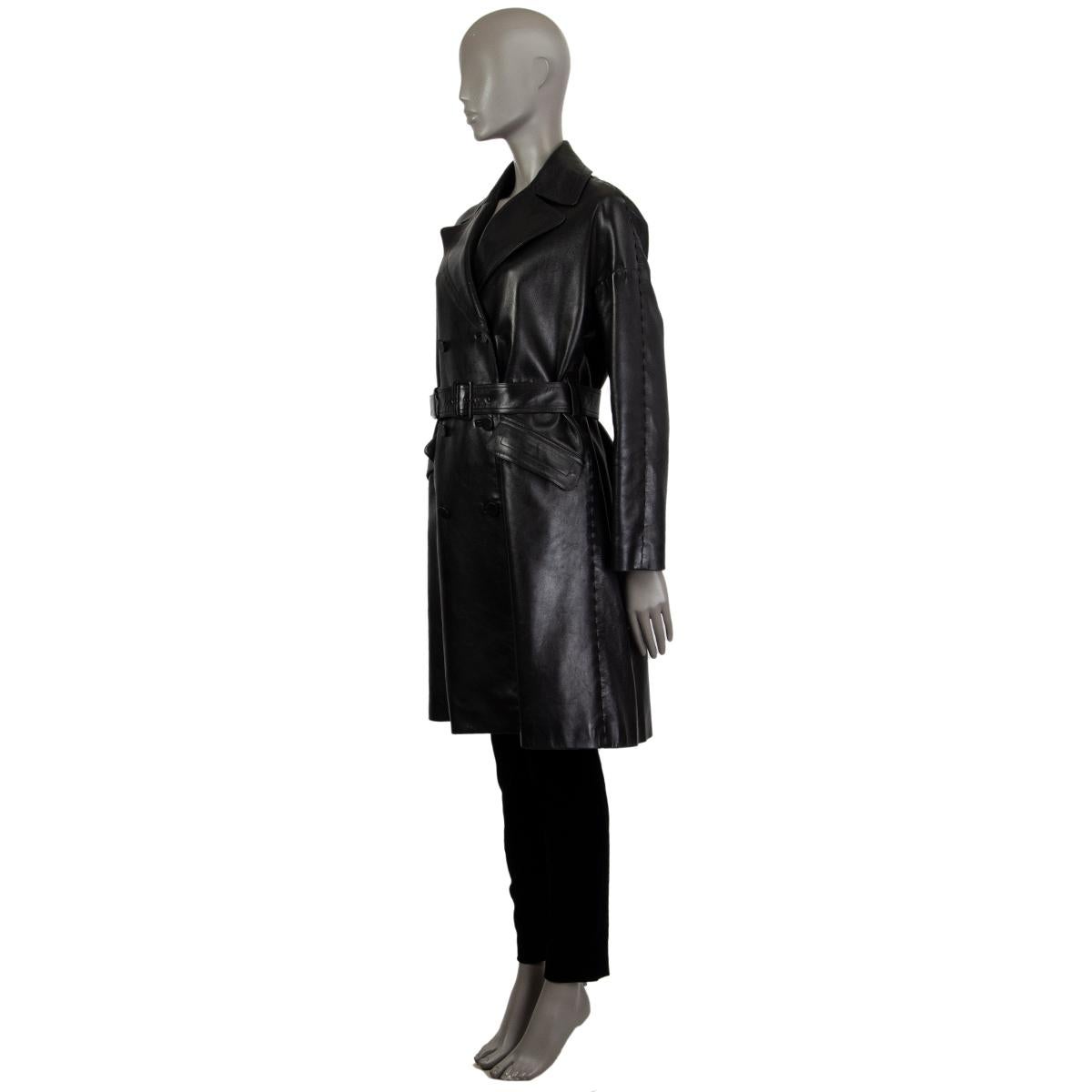 Alaia trench coat in black lambskin. With wide notch colar, belt loops at the waist, two flap pockets on the front sides, box pleat on the back, and woven seams. Closes with flat lether buttons on the front. Lined in black acetate (68%) and viscose