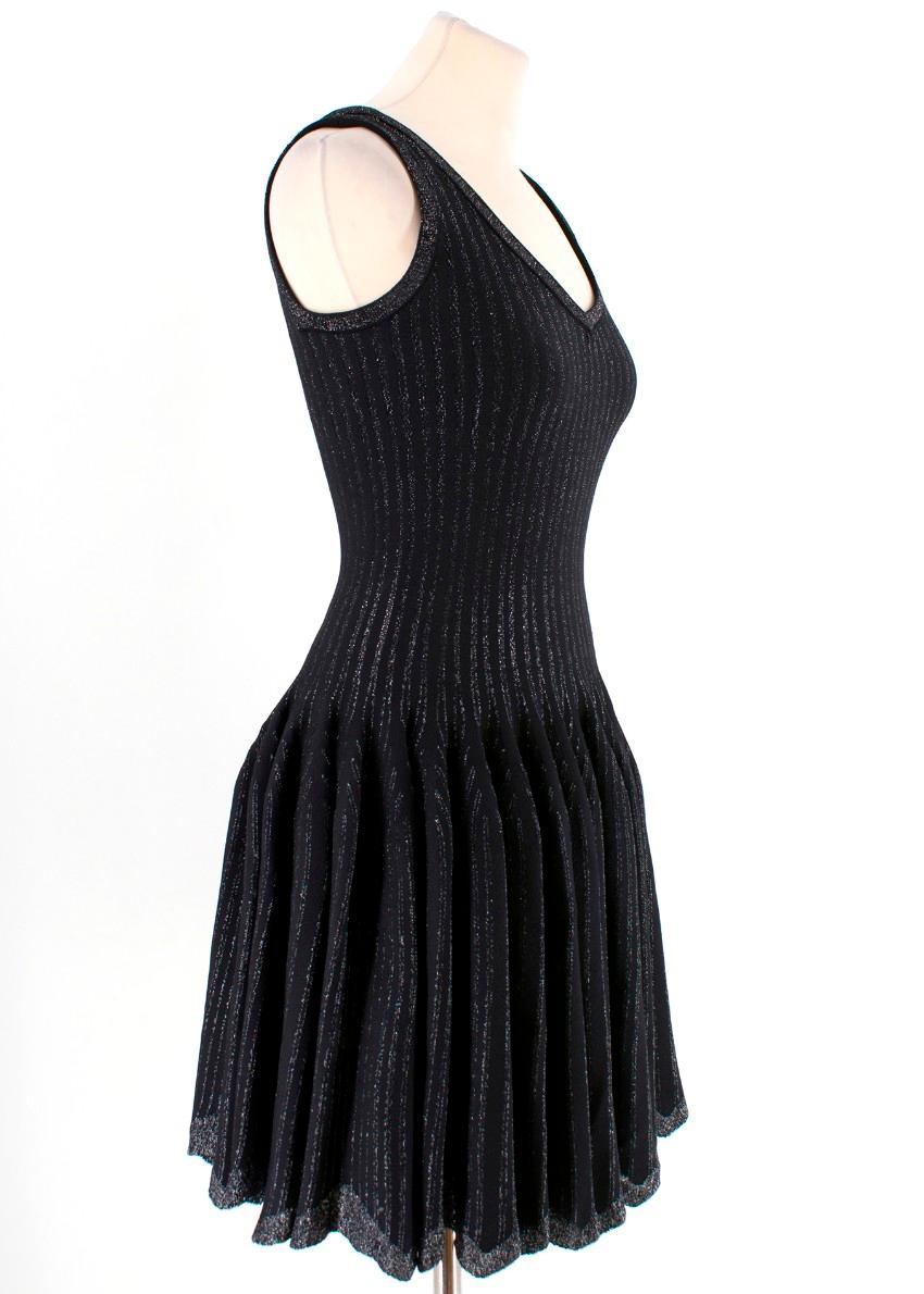Alaia Black with Silver Stripes Dress

-Alaia dress with silver tone accent stripes
-Sparkle neckline, straps and hemline
-Pleated skirt
-Scalloped hemline
-Hidden back zip
-V neck

Please note, these items are pre-owned and may show signs of being