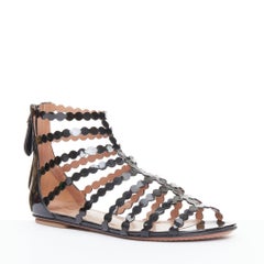 ALAIA black patent leather laser cut scalloped cage gladiator flat sandals EU36