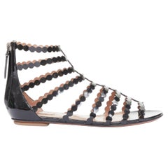 ALAIA black patent leather laser cut scalloped cage gladiator flat sandals EU36