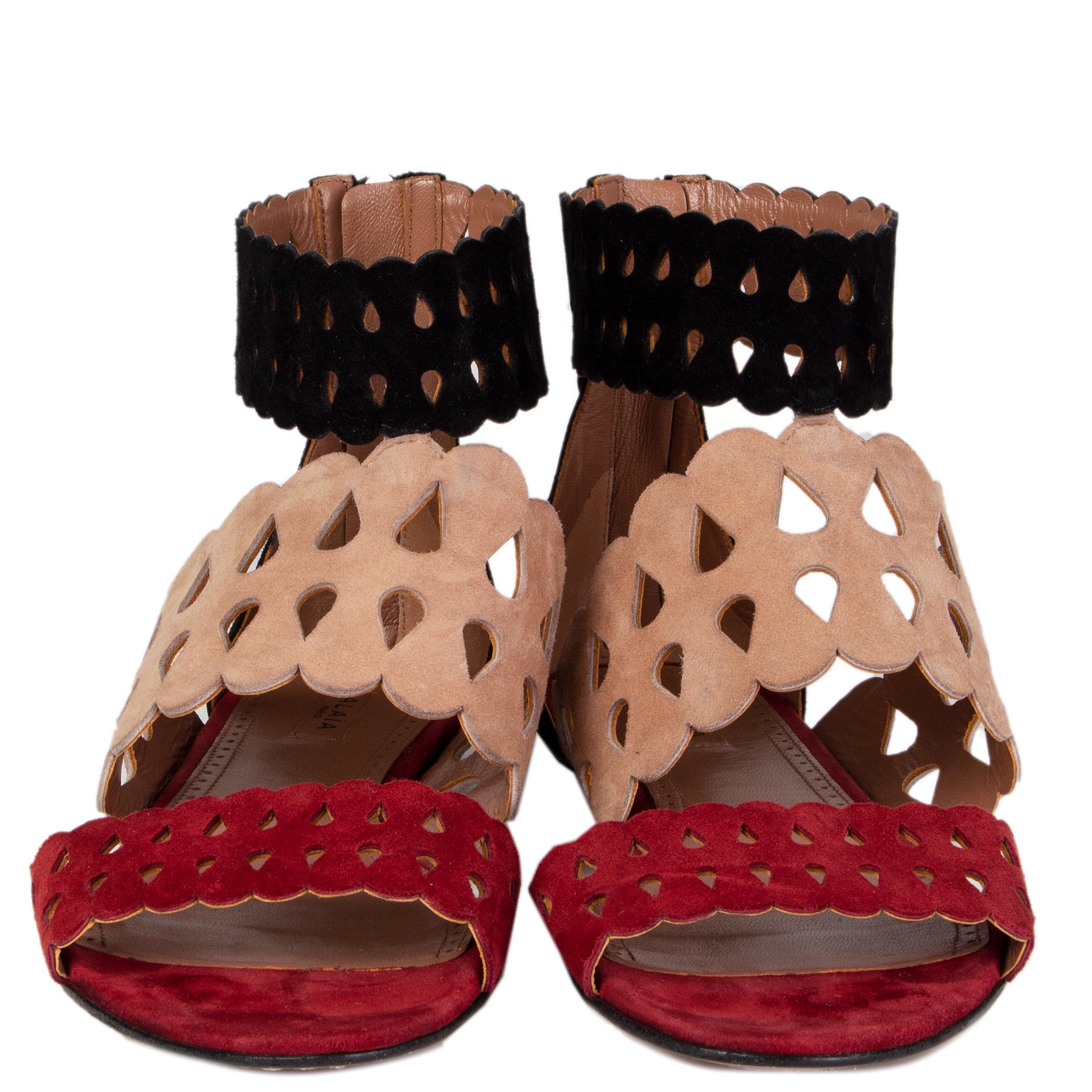 100% authentic Alaïa flat ankle-strap sandals in black, nude and burgundy suede. Open with zipper on the back of the heel. Have been worn inside and are in virtually new condition.

Measurements
Imprinted Size	37
Shoe Size	37
Inside Sole	24.5cm
