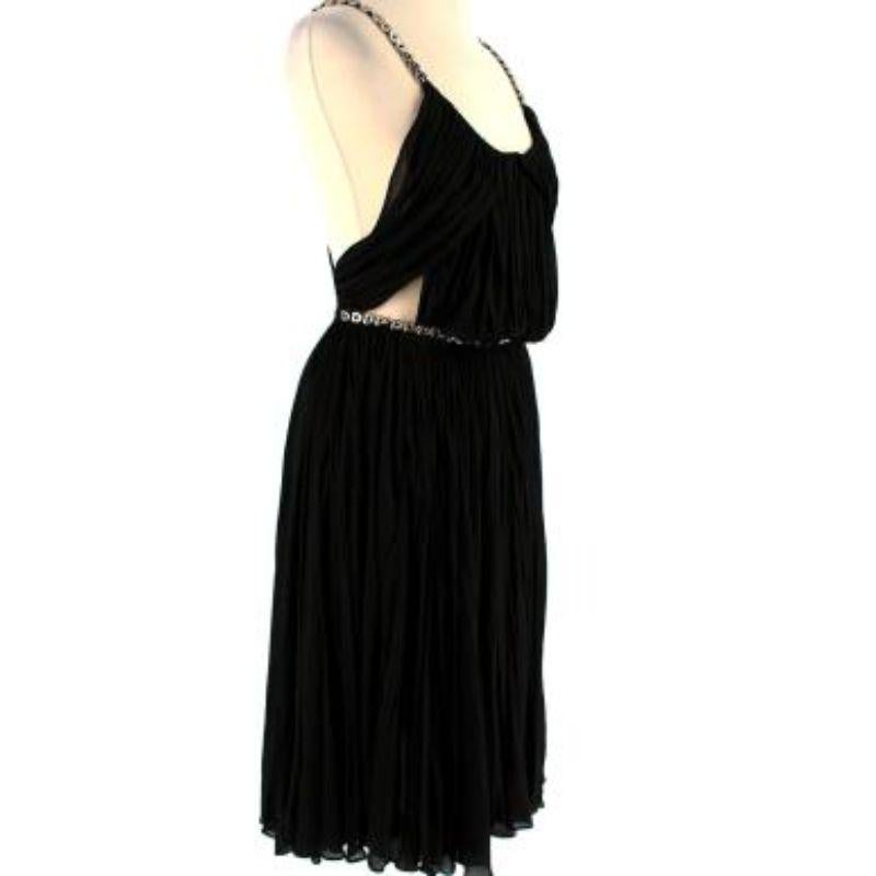 Alaia Black Pleated Chain Strap Dress
- Silver chain shoulder straps

- Knee-length
- Pleated detailing throughout
- Fully lined
- Belt chain fastening
- Cut-out detailing

Material
100% Cupro 

Dry clean only

Made in France

9.5/10 Excellent