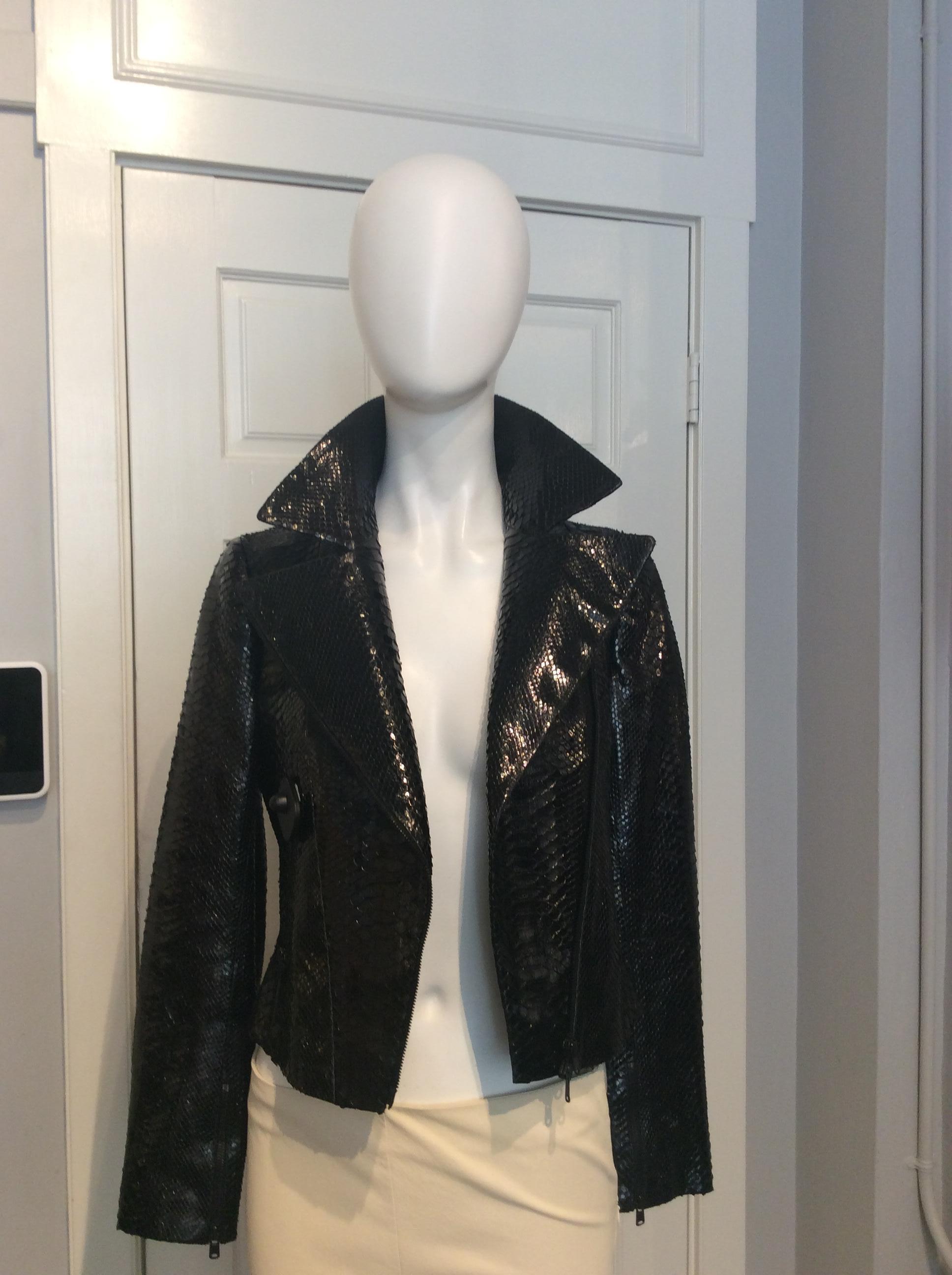 Alaia Black Snakeskin Cropped Moto Jacket, Size 38
Black Python Cropped Jacket with Triangular Cutout Details
Asymmetrical Zipper Closure
Zipper front pockets and Zippered sleeves
