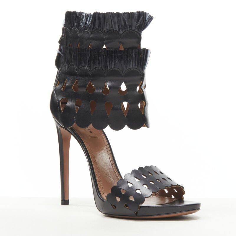 ALAIA black squiggle cut out raffia fringe platform high heel sandals EU38
Reference: KEDG/A00215
Brand: Alaia
Designer: Azzedine Alaia
Material: Leather
Color: Black
Pattern: Solid
Closure: Zip
Lining:  Leather
Extra Details: Zip back closure.