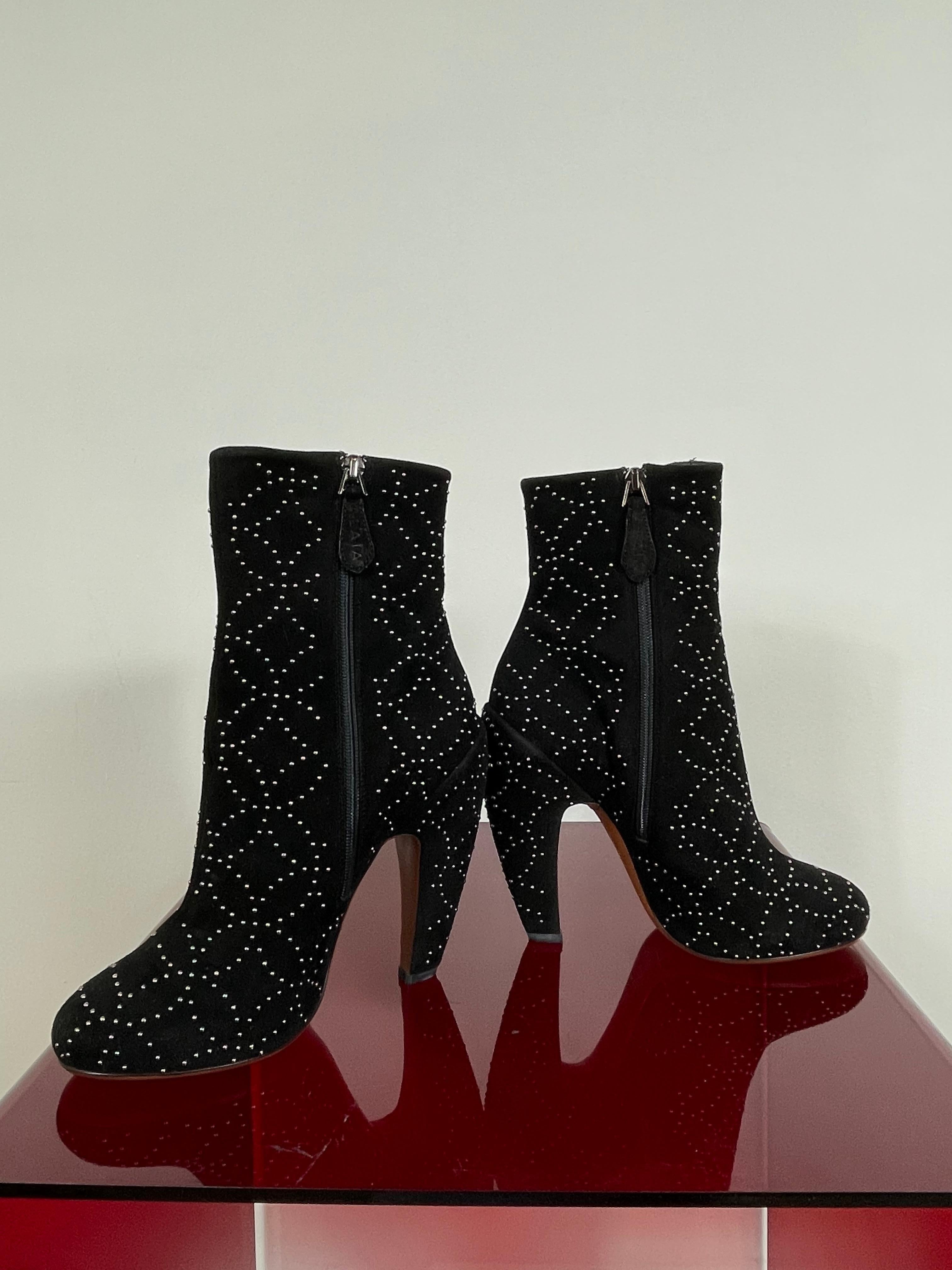 Alaia ankle boot.
In black suede. Featuring small studs as bright application. Perfect for festive time!
Number 36 Italian. Heels measure 13 cm.
Conditions: New - Brand-new, not previously worn or owned. 
It comes with original dust bag.
Retail