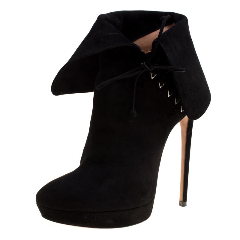 Gorgeous is the word for these black ankle boots from Alaia! Crafted from suede, these boots feature round toes and are styled with an ankle cuff and a self-tie detailing. They come equipped with comfortable leather lined insoles, 14.5 cm stiletto