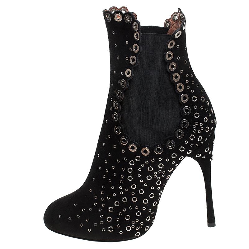 We've fallen love with these gorgeous ankle boots from Alaia! These black boots are crafted from suede and feature round toes. They've been embellished with eyelets on the exterior and come equipped with comfortable leather-lined insoles and 11.5 cm