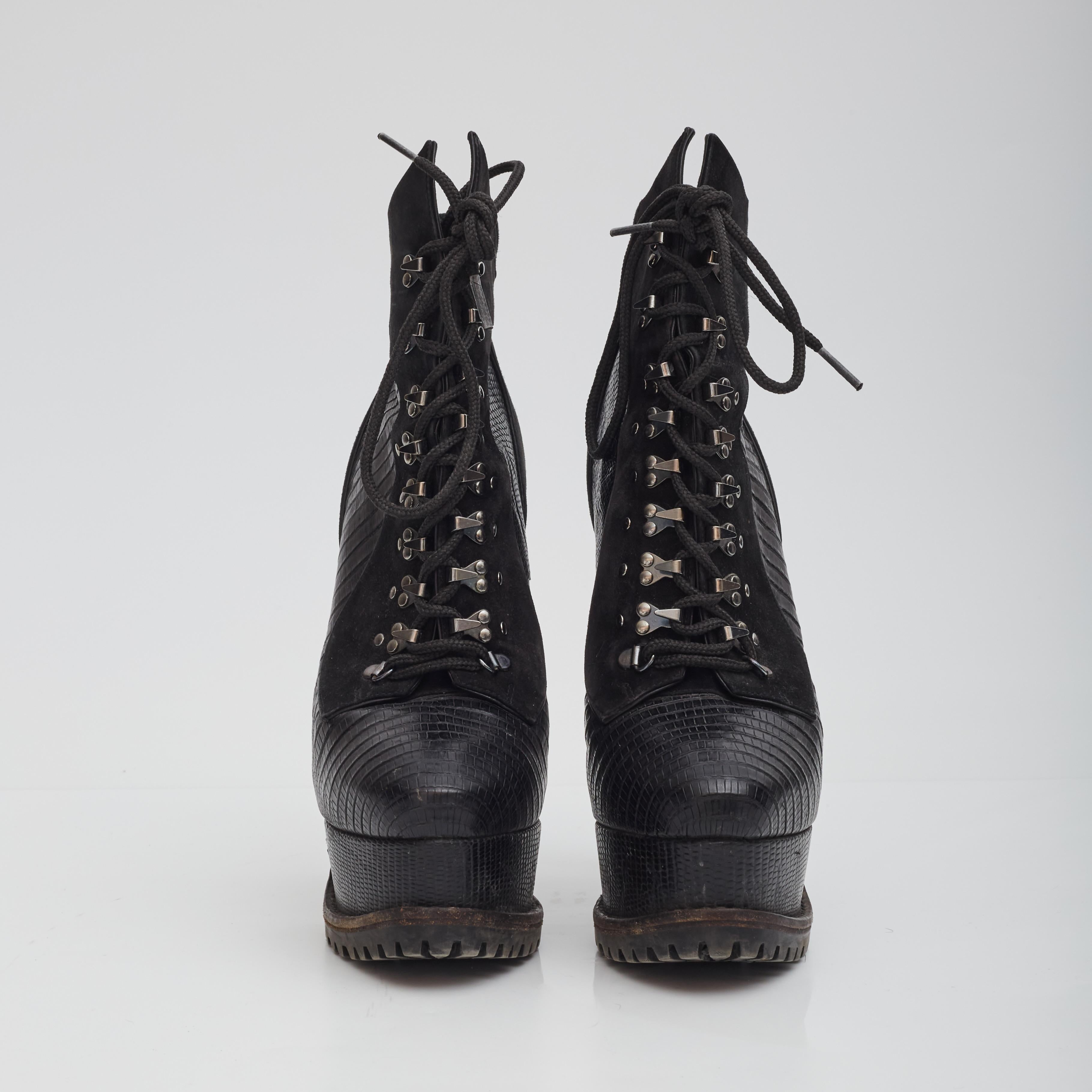 Color: Black
Material: Leather and suede 
Size: 39 EU / 8 US
Heel Height: 165 mm / 6.5”
Platform Height: 50 mm / 1.2” 
Condition: Good. Water damage to suede throughout, cut to top fabric, light signs of use and scrapes to the bottoms. Needs to go
