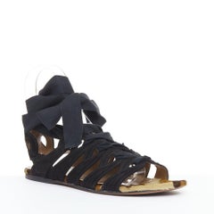 ALAIA Gladiator-Sandalen aus schwarzem Wildleder mit Leopardenmuster und Ponyhaar, mit Wickelriemen und Schnürung, Größe 36,5 (EU)