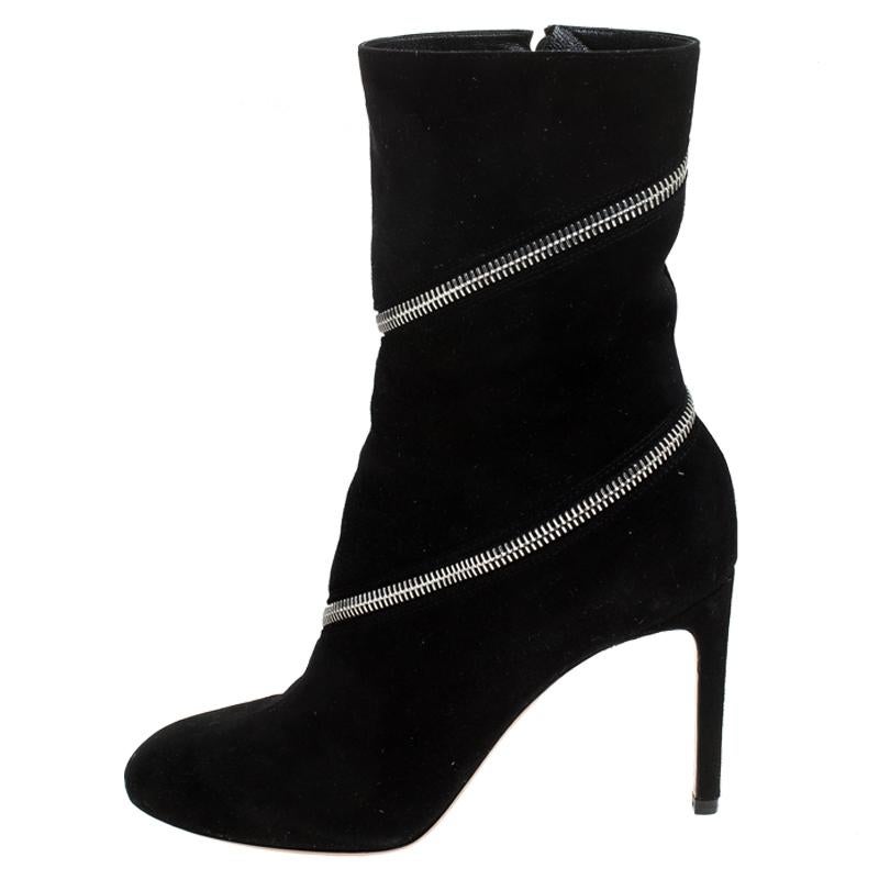 Alaia's creations rule the hearts of many fashionistas across the globe. These ankle boots from the house are made from supple black suede and set on a 9cm high stiletto heel. It features an eye-catching zip detailing across the body and secured