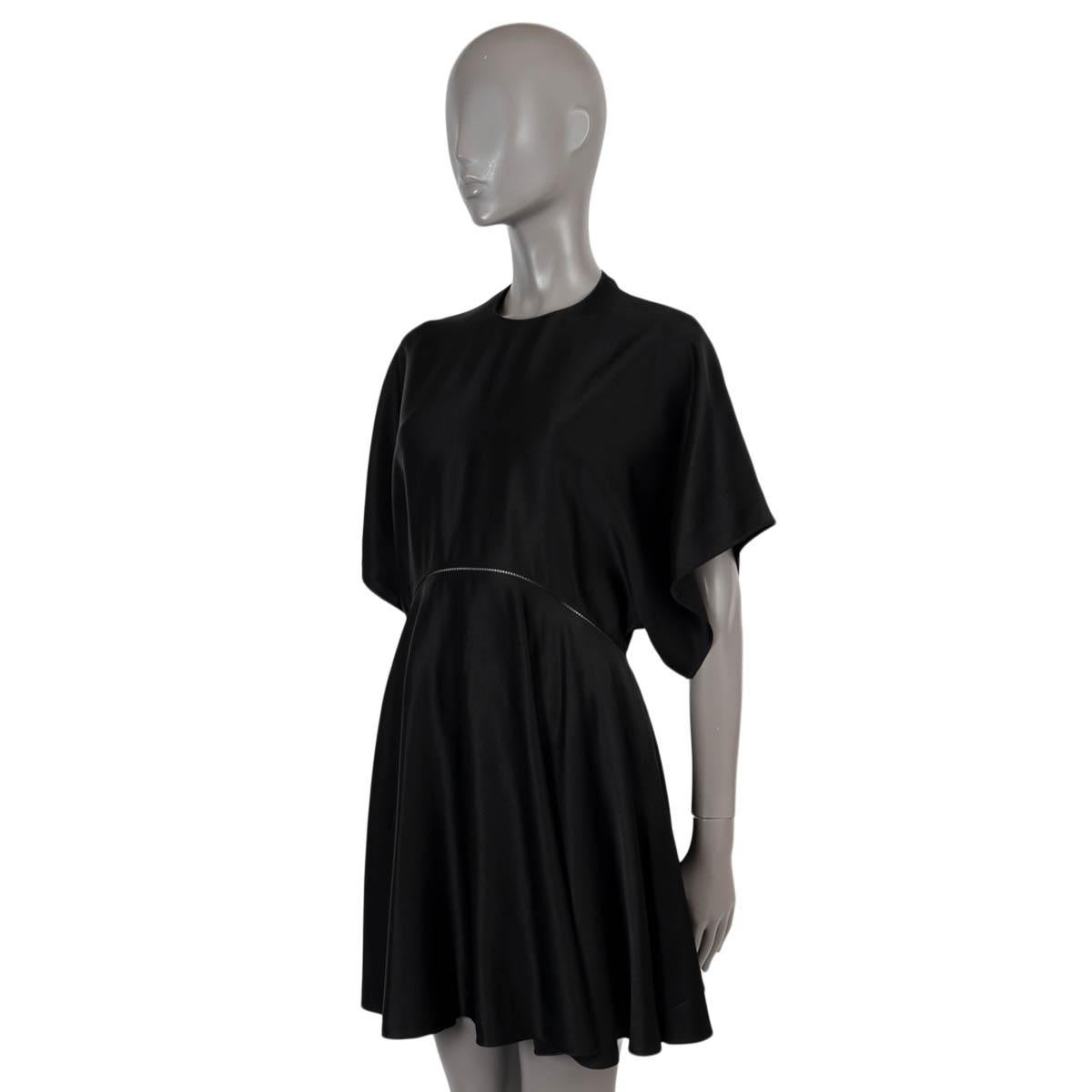 100% authentic Alaïa short skater dress in black viscose (56%) and acetate (44%). Features short sleeves, a flared skirt and a pointelle stripe at the waist. Opens with a concealed zipper on the back. Unlined. Has been worn and is in excellent