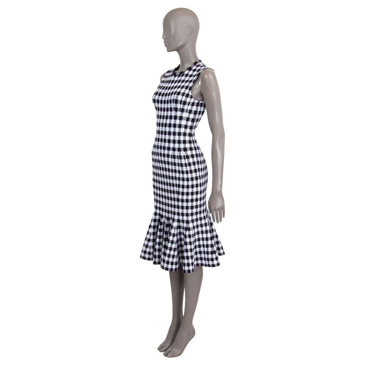 100% authentic Alaia houndstooth mermaid midi dress in black and white viscose (44%), polyamide (43%), polyester (9%) and elastane (4%). Features a ruffled trim and opens with a concealed zipper at the side. Unlined. Has been worn once and is in